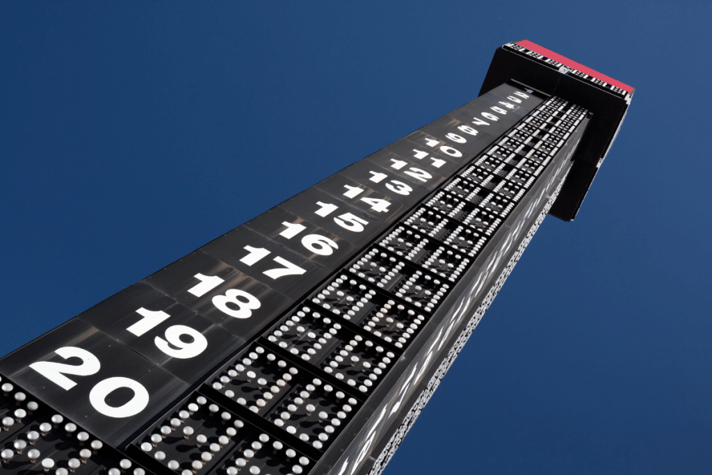 4 Powerful Ways Gamification is Revolutionizing Modern Marketing 8 Tall vertical leaderboard display showing race positions from 1 to 20 against a clear blue sky.